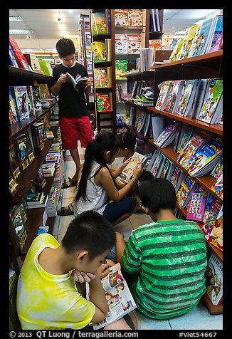 Children reading in bookstore. Ho Chi Minh City, Vietnam (color)