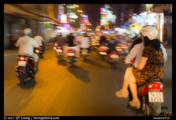 Riders view of motorcycle traffic blurred by speed. Ho Chi Minh City, Vietnam