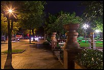 Sidewalk and park at night. Ho Chi Minh City, Vietnam