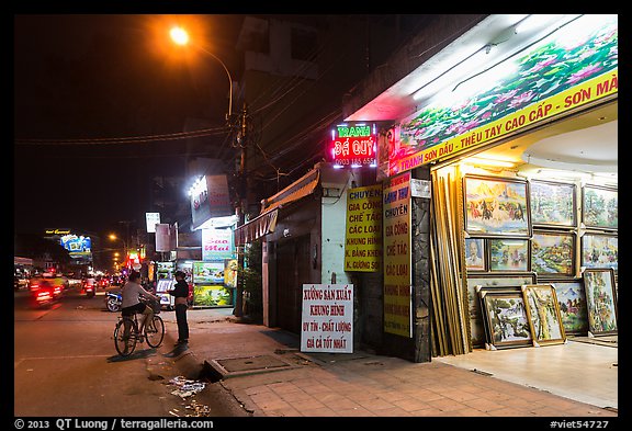 Stores selling pictures at night. Ho Chi Minh City, Vietnam