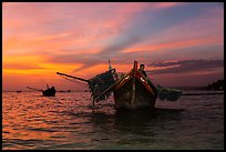 Man on fishing boat at sunset. Mui Ne, Vietnam ( color)