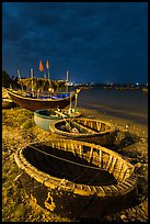 Coracle boats at night. Mui Ne, Vietnam (color)