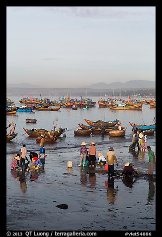 Miror-like beach and fishing boats, early morning. Mui Ne, Vietnam