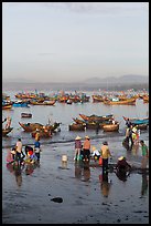 Miror-like beach and fishing boats, early morning. Mui Ne, Vietnam ( color)