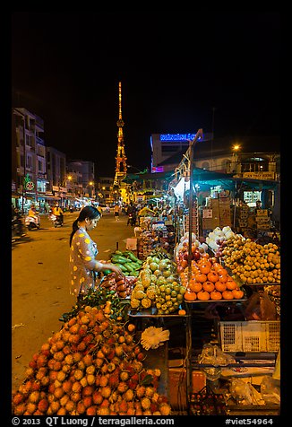 Fruit vendor on main street at night. Tra Vinh, Vietnam