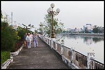 Elderly women strolling on riverfront. Tra Vinh, Vietnam ( color)