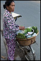 Woman vending food out of bicycle. Tra Vinh, Vietnam ( color)