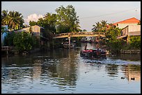 Barge and canal-side houses. Mekong Delta, Vietnam ( color)