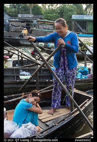 Woman and girl, Phung Diem floating market. Can Tho, Vietnam (color)