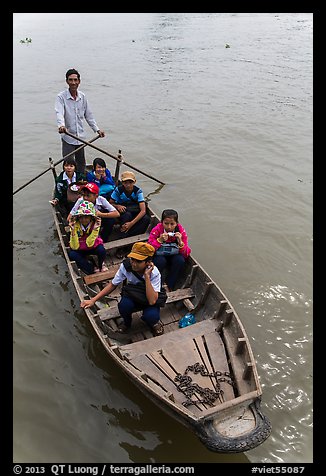 Schoolchildren rowed by parent. Can Tho, Vietnam