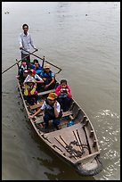 Schoolchildren rowed by parent. Can Tho, Vietnam (color)