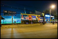 Street and stadium at night, District 8. Ho Chi Minh City, Vietnam