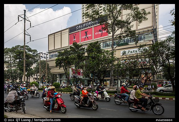 Motorcycle traffic and Hung Vuong Plaza mall. Cholon, Ho Chi Minh City, Vietnam