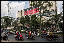 Motorcycle traffic and Hung Vuong Plaza mall. Cholon, Ho Chi Minh City, Vietnam
