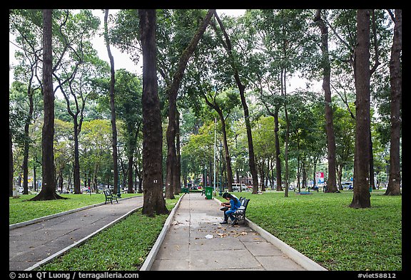 Couple looking at mobile phone, April 30 Park. Ho Chi Minh City, Vietnam