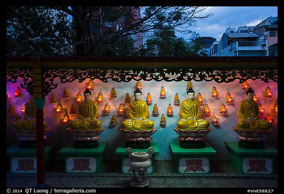 Buddha images at dusk, Viet Nam Quoc Tu pagoda. Ho Chi Minh City, Vietnam (color)