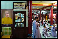 Women in prayer inside Quoc Tu pagoda. Ho Chi Minh City, Vietnam