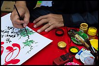 Hands drawing Tet greetings. Ho Chi Minh City, Vietnam ( color)
