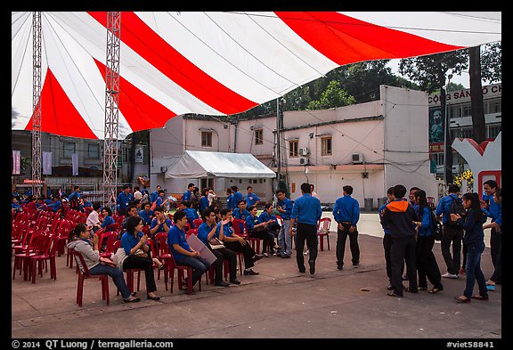 Uniformed young men and women gather for lunar new year. Ho Chi Minh City, Vietnam (color)