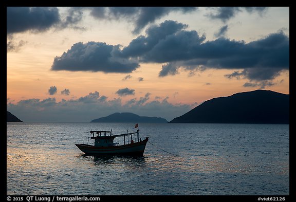 Fishing boat and Con Son Bay, sunrise. Con Dao Islands, Vietnam (color)