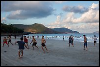 Men play soccer on beach, Con Son. Con Dao Islands, Vietnam ( color)