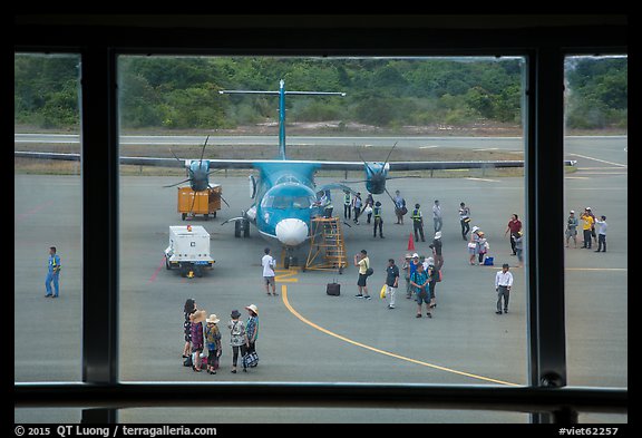Airport tarmac with just deplaned passengers. Con Dao Islands, Vietnam (color)