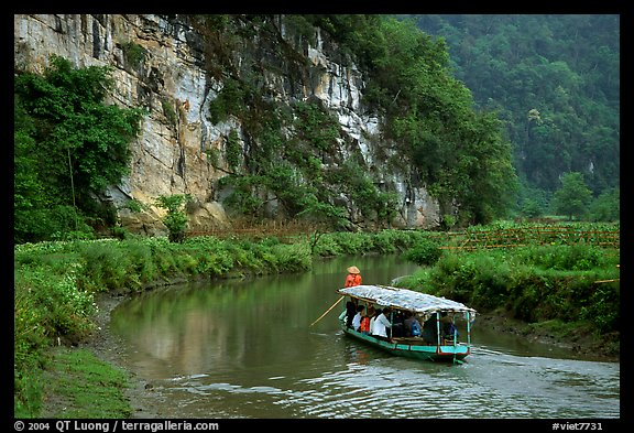 Shallow boats transport villagers to a market. Northeast Vietnam (color)