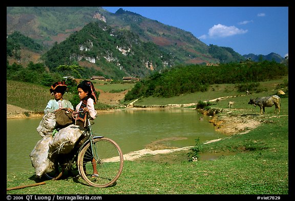 Thai women load a bicycle, near Tuan Giao. Northwest Vietnam