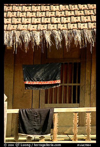 Detail of hut with montagnard dress being dried, between Tuan Giao and Lai Chau. Northwest Vietnam (color)