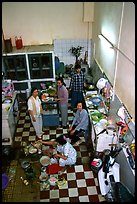 Women in a home kitchen. Ho Chi Minh City, Vietnam (color)