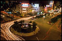 Traffic: at the heart of the city, intersection of Le Loi and Nguyen Hue boulevards at night. Ho Chi Minh City, Vietnam ( color)