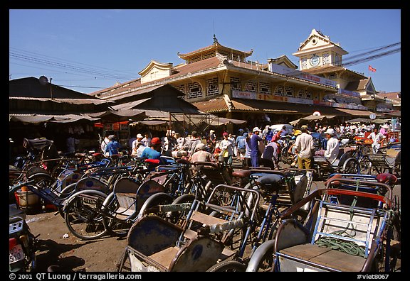 Cyclos wait outside the Bin Tay market in Cholon, district 6. Cholon, Ho Chi Minh City, Vietnam (color)