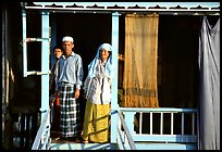 Muslem family outside stilt house in Cham minority village. Chau Doc, Vietnam (color)