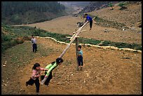 Children playing a rotating swing near Can Cau. Vietnam ( color)