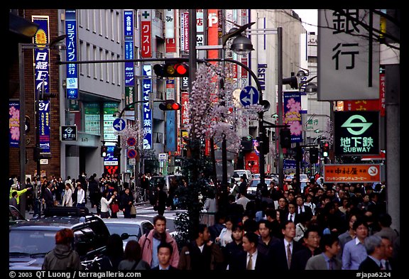 Street in Shinjuku 3-chome looking towards Yotsuya in front of Kinokuniya. Tokyo, Japan