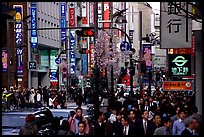 Street in Shinjuku 3-chome looking towards Yotsuya in front of Kinokuniya. Tokyo, Japan