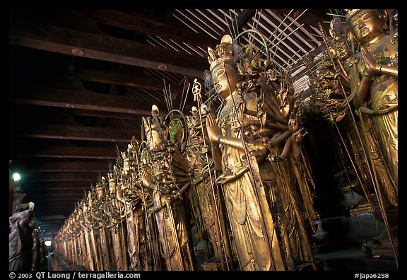 Rows of statues of the thousand-armed Kannon (buddhist goddess of mercy), Sanjusangen-do Temple. Kyoto, Japan