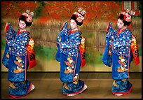 Maiko (apprentice Geisha) dress elaborately to perform the Miyako Odori (cherry blossom dance). Kyoto, Japan (color)