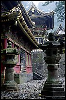 Urns, pavilion, and main hall in Tosho-gu Shrine. Nikko, Japan