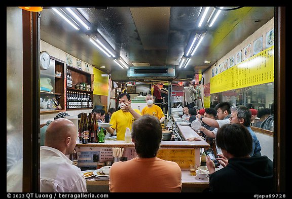 Dinners in small restaurant, Shinjuku. Tokyo, Japan (color)