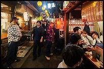 Crowded alley lined up with bars and restaurants, Omoide Yokocho, Shinjuku. Tokyo, Japan ( color)