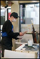 Man preparing tako senbei octopus cracker. Enoshima Island, Japan ( color)