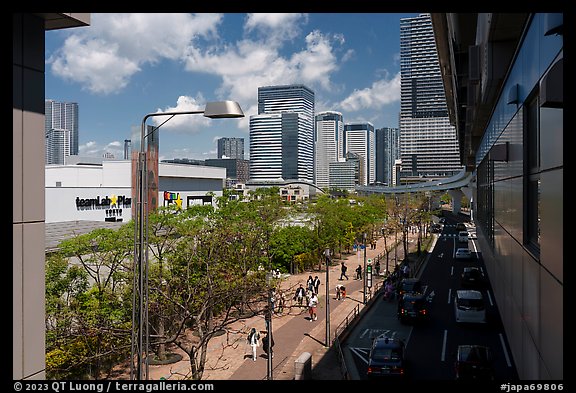 Toyosu street with train and TeamLab building. Tokyo, Japan (color)