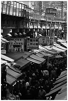 Alley lined with stores beneath the subway in a popular district. Tokyo, Japan ( black and white)