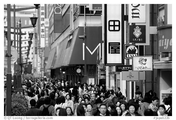 Crowded avenue in the Ginza shopping district. Tokyo, Japan (black and white)