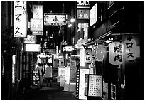 Narrow alley in the Pontocho entertainment district by night. Kyoto, Japan (black and white)