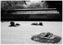 Classic stone and raked sand Zen garden, Ryoan-ji Temple. Kyoto, Japan ( black and white)