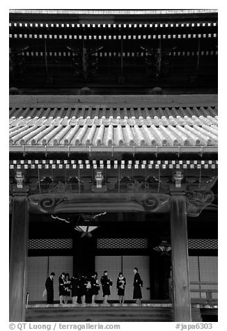 Uniformed schoolgirls visit Higashi Hongan-ji Temple. Kyoto, Japan (black and white)