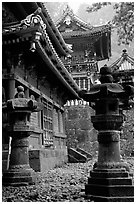 Urns, pavilion, and main hall in Tosho-gu Shrine. Nikko, Japan (black and white)