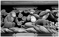 Three-monkey relief carving (hear no evil, see no evil, speak no evil) on Shinkyusha. Nikko, Japan (black and white)